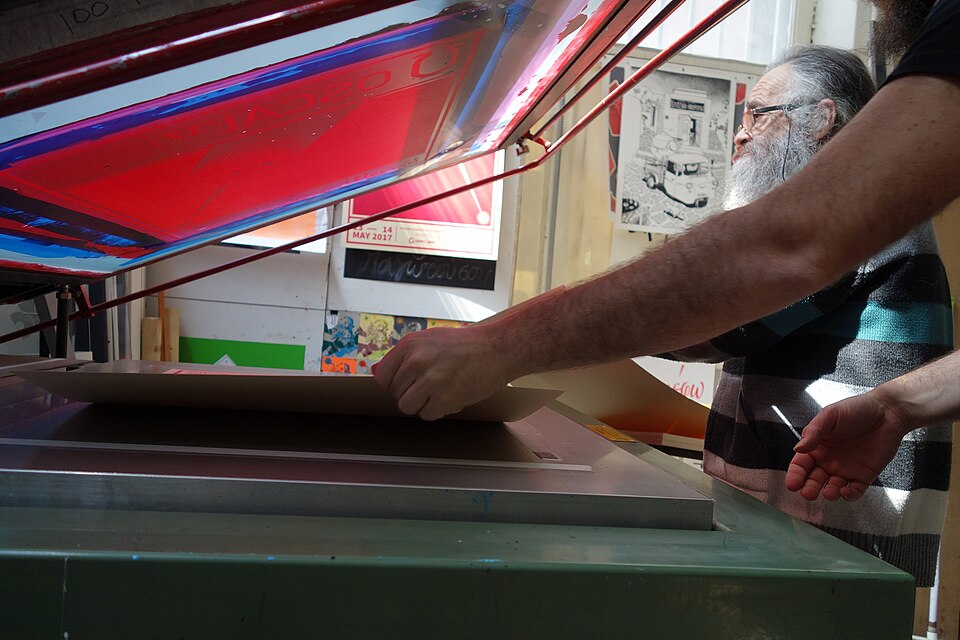 Photos from the production process of the promo materials (posters and tote bags) of the fourth edition of Open Source Conference Albania that takes place in Tirana Albania in the second weekend of May 2017. The materials were printed using the silkscreen method.